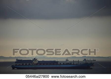 Tanker in ocean near Singapore, storm overhead. View Large Photo Image Stock Image - Tanker in ocean near Singapore, storm overhead.. Fotosearch