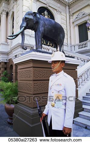 Stock Image - Thailand, Bangkok, Wat Phra Kaeo, Grand Palace, Guard at the Royal Palace. Fotosearch