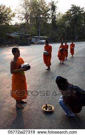 Thailand, Chiang Mai, Monks Receiving Offerings of Food View Large Photo Image Stock Photo - Thailand, Chiang Mai, Monks Receiving Offerings of Food. Fotosearch