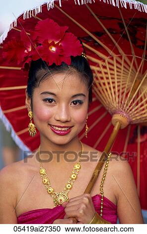 Thailand, Chiang Mai, Portrait of Girl in Traditional Thai Costume at the Chiang Mai Flower Festival View Large Photo Image Stock Image - Thailand, Chiang Mai, Portrait of Girl in Traditional Thai Costume at the Chiang Mai Flower Festival. Fotosearch
