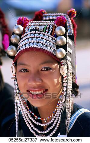 Stock Photo - Thailand, Chiang Rai, Akha Hilltribe Girl Wearing Traditional Silver Headpiece. Fotosearch