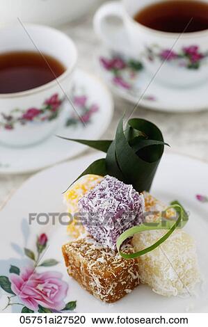 Traditional Peranakan coconut sweets with tea. View Large Photo Image Stock Image - Traditional Peranakan coconut sweets with tea.. Fotosearch