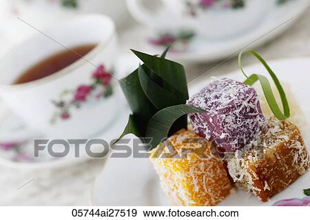 Stock Photo - Traditional Peranakan sweets with tea.. Fotosearch