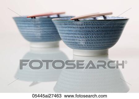 Two China bowls with chopsticks on top View Large Photo Image Stock Image - Two China bowls with chopsticks on top. Fotosearch