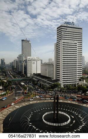 Stock Image - Welcome Monument and buildings along Jalan Thamrin, Jakarta. Fotosearch