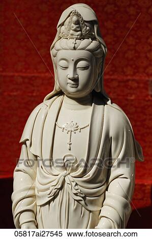 Stock Photography - White "Guan Yin" Goddess of Mercy statue. Fotosearch