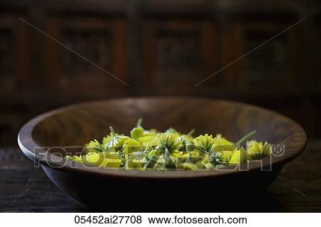 Yellow chrysanthemum flowers in wooden bowl View Large Photo Image Stock Photo - Yellow chrysanthemum flowers in wooden bowl. Fotosearch