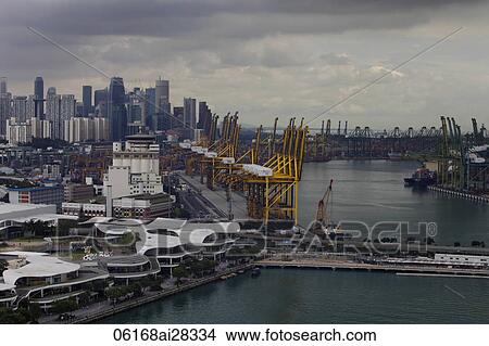 Ariel view of Harbour city and ship yard with Singapore skyline in background View Large Photo Image Picture - Ariel view of Harbour city and ship yard with Singapore skyline in background. Fotosearch