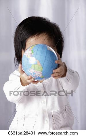 Baby holding small globe View Large Photo Image Stock Image - Baby holding small globe. Fotosearch