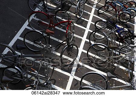 Bicycles parked in lot. Japan View Large Photo Image Stock Photo - Bicycles parked in lot. Japan. Fotosearch