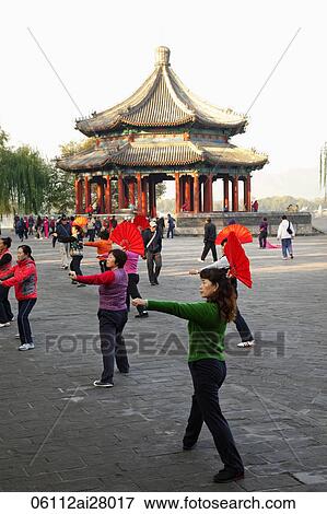 China, Beijing, Summer Palace Park, Woman Exercising with fans View Large Photo Image Stock Photo - China, Beijing, Summer Palace Park, Woman Exercising with fans. Fotosearch