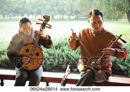 Picture - China, Beijing, Temple of Heaven Park, Man and Woman Playing Traditional Chinese Stringed Instruments. Fotosearch