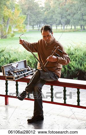 China, Beijing, Temple of Heaven Park, Man Playing Erdu Traditional Stringed Instrument View Large Photo Image Stock Image - China, Beijing, Temple of Heaven Park, Man Playing Erdu Traditional Stringed Instrument. Fotosearch