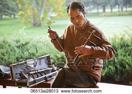 China, Beijing, Temple of Heaven Park, Man Playing Erdu Traditional Stringed Instrument View Large Photo Image Stock Image - China, Beijing, Temple of Heaven Park, Man Playing Erdu Traditional Stringed Instrument. Fotosearch