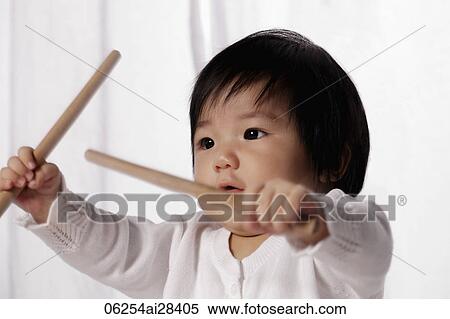 Chinese baby holding drum sticks View Large Photo Image Stock Photography - Chinese baby holding drum sticks. Fotosearch