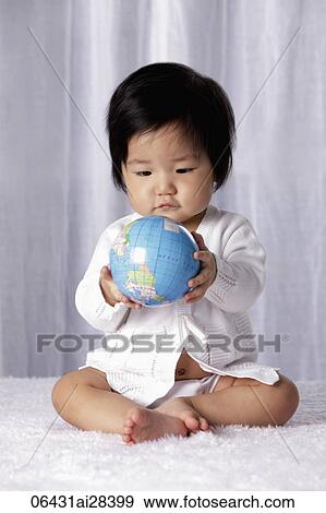 Stock Photo - Chinese baby holding small globe. Fotosearch