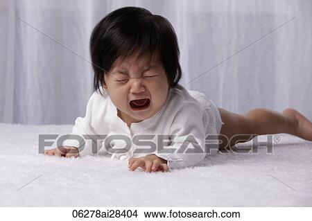Chinese baby on tummy crying View Large Photo Image Picture - Chinese baby on tummy crying. Fotosearch