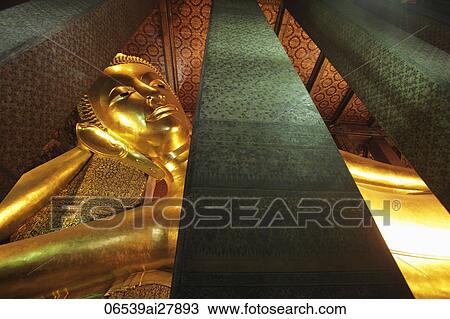 Stock Image - Close up of gold reclining Buddha at Wat Pho Temple, Thailand. Fotosearch