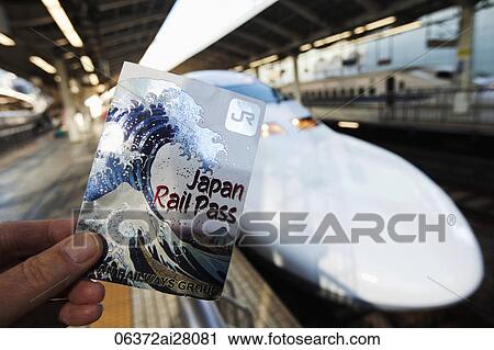 Close up of hand holding a Rail Pass for bullet train (Shinkansen). Japan View Large Photo Image Stock Image - Close up of hand holding a Rail Pass for bullet train (Shinkansen). Japan. Fotosearch
