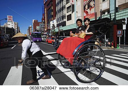 Couple in Rickshaw crossing the street. Japan, Tokyo, Asakusa, View Large Photo Image Stock Photo - Couple in Rickshaw crossing the street. Japan, Tokyo, Asakusa,. Fotosearch