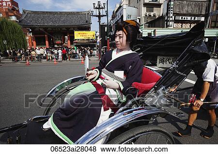 Geisha in Rickshaw in front of Asakusa Kannon Temple. Tokyo, Japan View Large Photo Image Stock Photo - Geisha in Rickshaw in front of Asakusa Kannon Temple. Tokyo, Japan. Fotosearch
