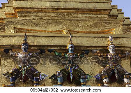 Stock Image - Gold statues on Wat at Grand Palace, Bangkok Thailand.. Fotosearch