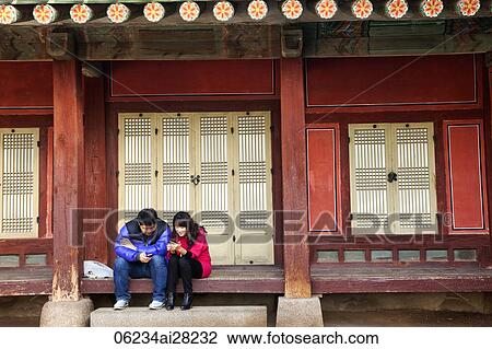 Gyeongbokgung Palace, Couple with Mobile Phones, Seoul, Korea View Large Photo Image Stock Image - Gyeongbokgung Palace, Couple with Mobile Phones, Seoul, Korea. Fotosearch
