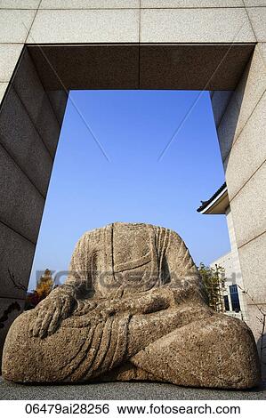 Stock Photograph - Gyeongju National Museum, Headless Stone Buddha Statue, Korea. Fotosearch
