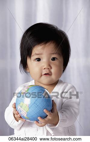 Head shot of Chinese baby holding small globe View Large Photo Image Stock Image - Head shot of Chinese baby holding small globe. Fotosearch
