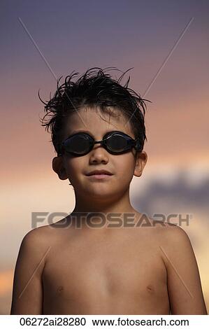Head shot of young boy with goggles at sunset View Large Photo Image Stock Image - Head shot of young boy with goggles at sunset. Fotosearch