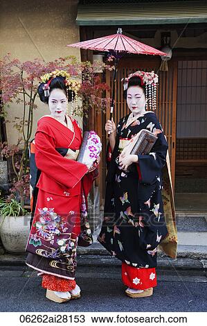 Japanese woman dressed in traditional clothing holding umbrella View Large Photo Image Stock Image - Japanese woman dressed in traditional clothing holding umbrella. Fotosearch