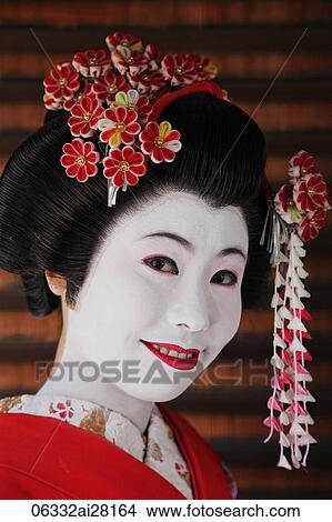 Japanese woman in traditional make up with flowers in her hair View Large Photo Image Picture - Japanese woman in traditional make up with flowers in her hair. Fotosearch
