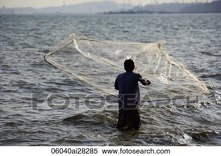 Man throwing net into the sea, Thailand View Large Photo Image Stock Photography - Man throwing net into the sea, Thailand. Fotosearch