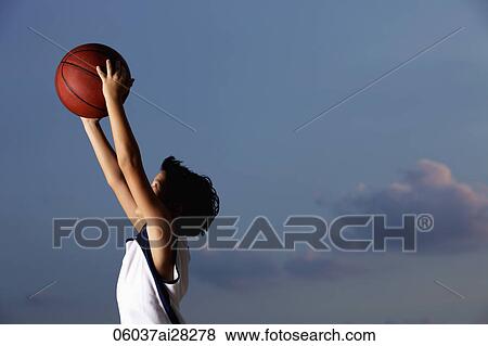 profile shot of young boy catching basketball View Large Photo Image Stock Photo - profile shot of young boy catching basketball. Fotosearch
