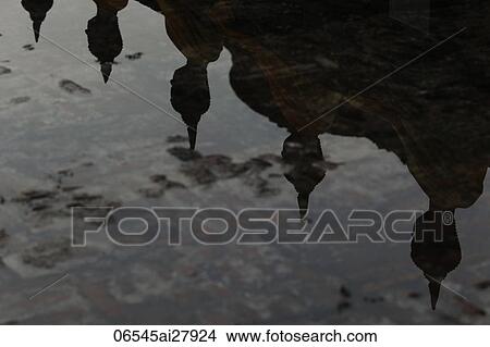 Reflection of stone Buddhas in water View Large Photo Image Picture - Reflection of stone Buddhas in water. Fotosearch