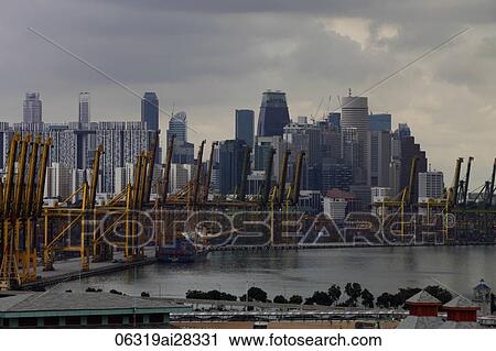 Shipping docks in front of Singapore city skyline. View Large Photo Image Stock Image - Shipping docks in front of Singapore city skyline.. Fotosearch