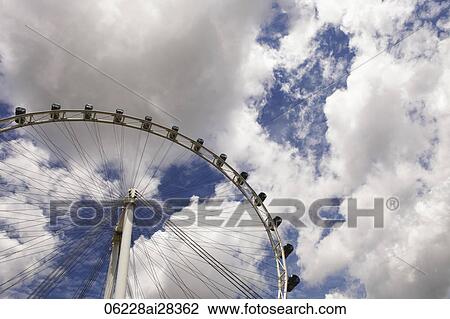 Singapore Flyer with white clouds as back ground View Large Photo Image Stock Image - Singapore Flyer with white clouds as back ground. Fotosearch