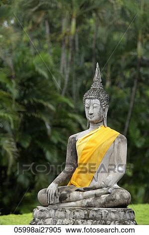 Stone Buddha in front of trees at Wat Yai Chaya Mongkol Temple, Thailand View Large Photo Image Stock Photography - Stone Buddha in front of trees at Wat Yai Chaya Mongkol Temple, Thailand. Fotosearch