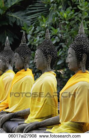Stone Buddhas in a line at Wat Yai Chaya Mongkol Temple, Thailand View Large Photo Image Stock Photo - Stone Buddhas in a line at Wat Yai Chaya Mongkol Temple, Thailand. Fotosearch