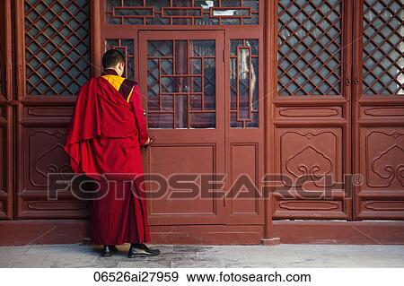 Tibetan Lama Temple or Yonghe Gong, Monk Opening Door. Beijing China View Large Photo Image Stock Photo - Tibetan Lama Temple or Yonghe Gong, Monk Opening Door. Beijing China. Fotosearch