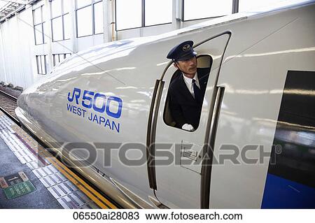 Train conductor leaning out of window of bullet train (Shinkansen), Japan View Large Photo Image Stock Image - Train conductor leaning out of window of bullet train (Shinkansen), Japan. Fotosearch