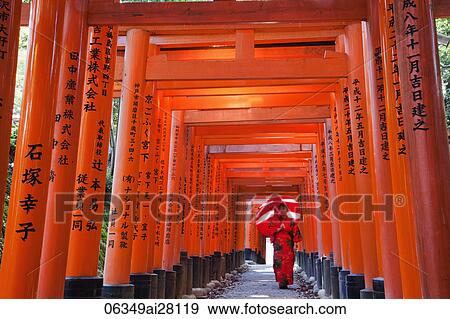 Woman in red Kimono holding red umbrella at Fushimi Inari Taisha Shrine, Tunnel of Torii Gates. View Large Photo Image Stock Photo - Woman in red Kimono holding red umbrella at Fushimi Inari Taisha Shrine, Tunnel of Torii Gates.. Fotosearch