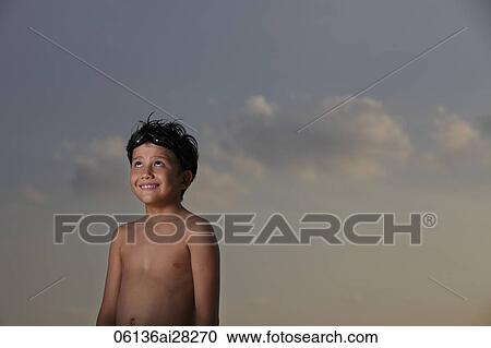 Young boy looking up with goggles on his head View Large Photo Image Stock Image - Young boy looking up with goggles on his head. Fotosearch