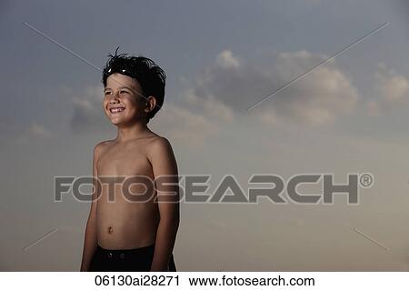 young boy smiling with goggles on his head out side View Large Photo Image Stock Image - young boy smiling with goggles on his head out side. Fotosearch