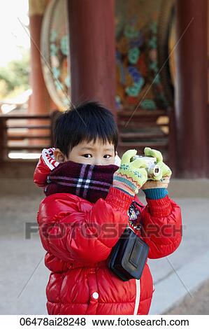 Young boy taking photo with Camera at Bulguksa Temple, Gyeongju Korea View Large Photo Image Stock Photo - Young boy taking photo with Camera at Bulguksa Temple, Gyeongju Korea. Fotosearch
