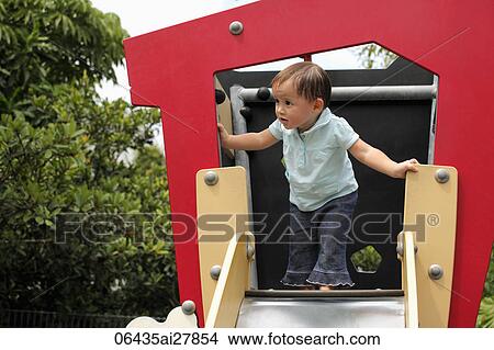 Young girl playing on slide View Large Photo Image Picture - Young girl playing on slide. Fotosearch