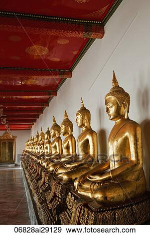 Stock Photo - A row of Buddha Statues at Wat Pho, Bangkok, Thailand. Fotosearch