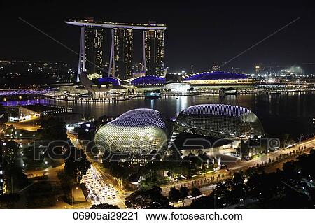 Stock Image - Buildings surrounding Marina Bay at night, Singapore. Fotosearch