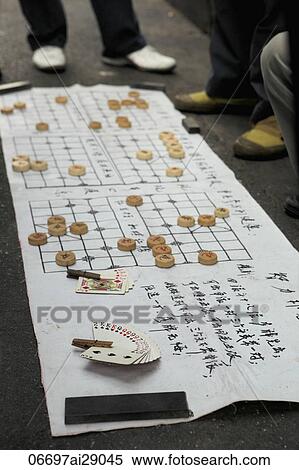 Chinese checkers game being played on the street in China View Large Photo Image Stock Photography - Chinese checkers game being played on the street in China. Fotosearch