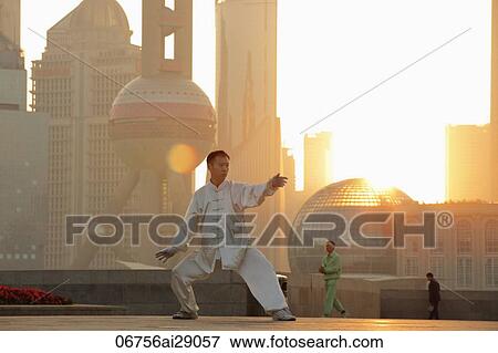 Chinese man doing martial arts in the morning on the Bund, Shanghai, China View Large Photo Image Stock Photo - Chinese man doing martial arts in the morning on the Bund, Shanghai, China. Fotosearch